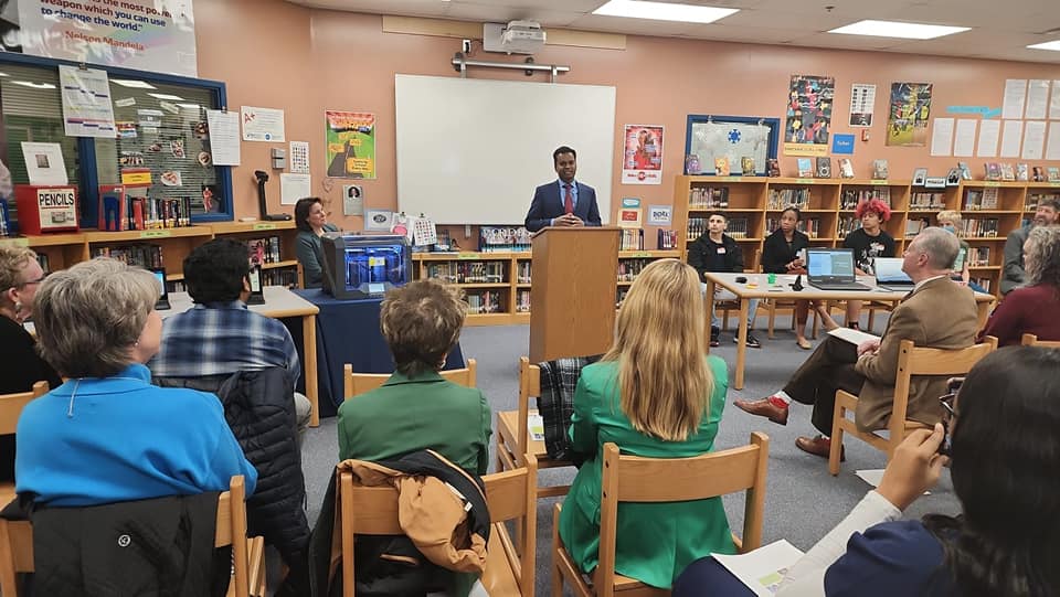 A speaker addressing a classroom gathering