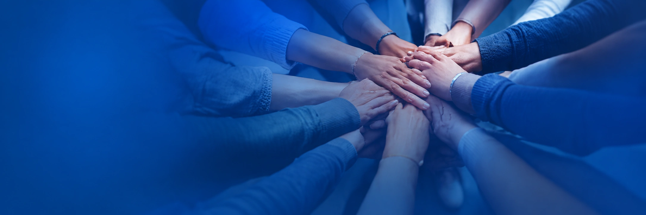 A group joining hands together